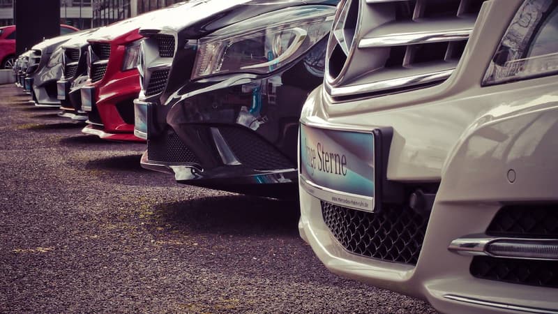 A row of vehicles on a dealership forecourt