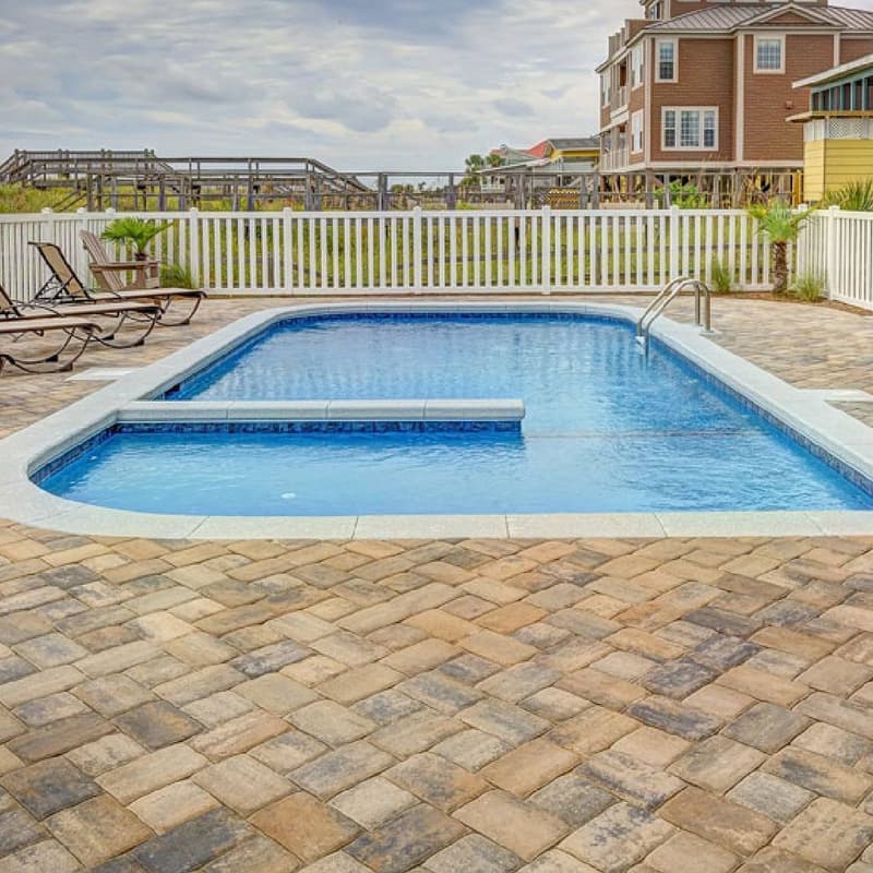 A finished residential pool and patio installation